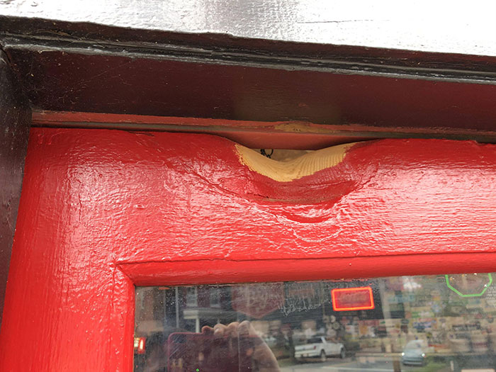 This Door Has Worn Away From 50 Or So Years Of Being Hit By A Bell When Opened