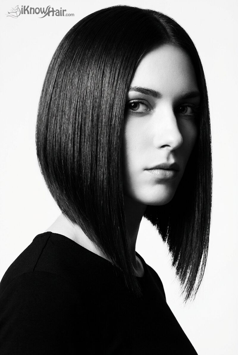 Stylish woman with asymmetrical bob at outdoor cafe terrace