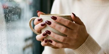 Deep Burgundy Almond Nails lifestyle shot for winter 2026